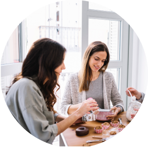 Two women are sitting at a table
